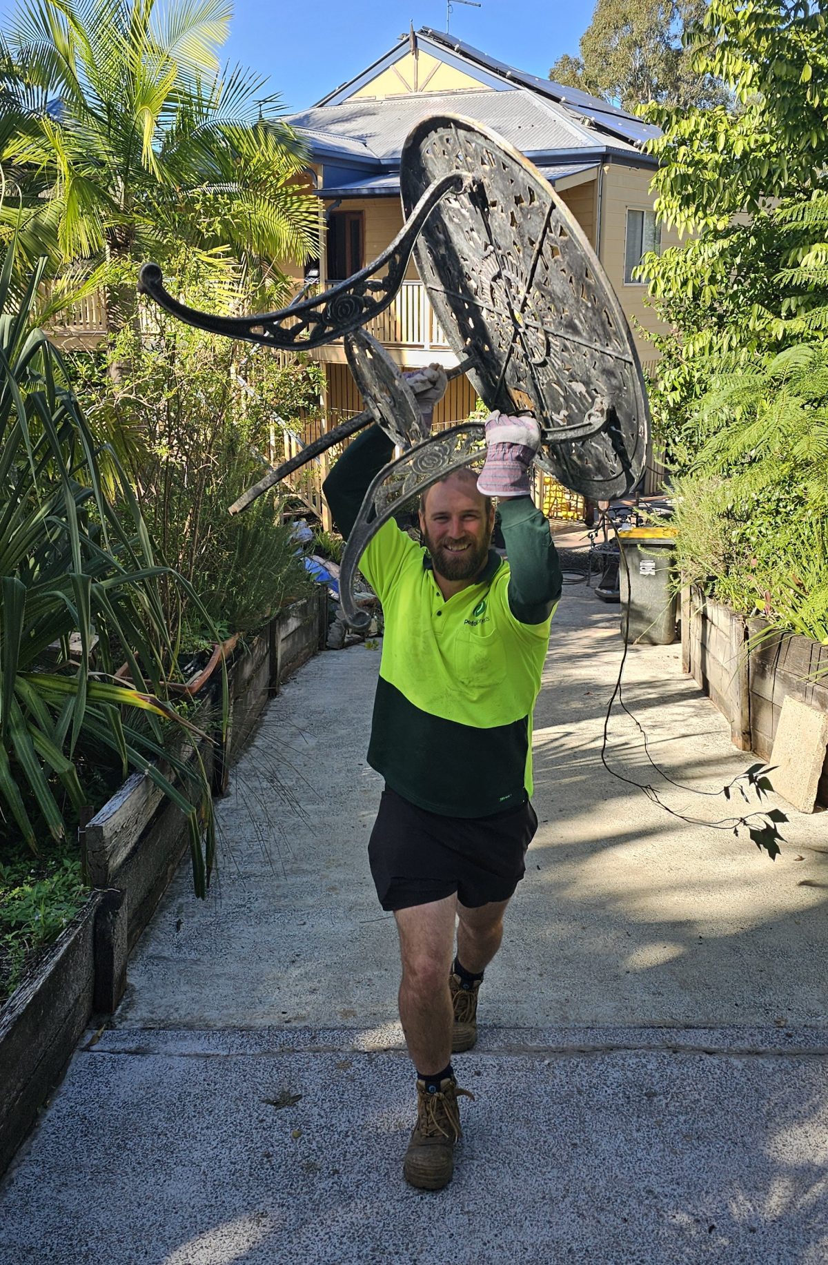 Dump Runners team loading rubbish into truck in Brisbane
